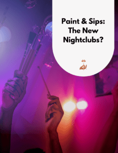 Hands waving paintbrushes in the air at a nightclub