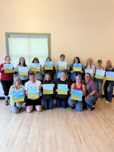 a group of teachers in lacey wa celebrating end of year with an artvana private paint party
